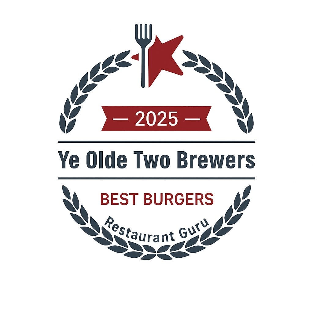 A circular award badge with a red star and fork at the top, laurel leaves, and reads: “2025 Ye Olde Two Brewers BEST BURGERS Restaurant Guru.”. A circular award badge with a red star and fork at the top, laurel leaves, and reads: “2025 Ye Olde Two Brewers BEST BURGERS Restaurant Guru.”.